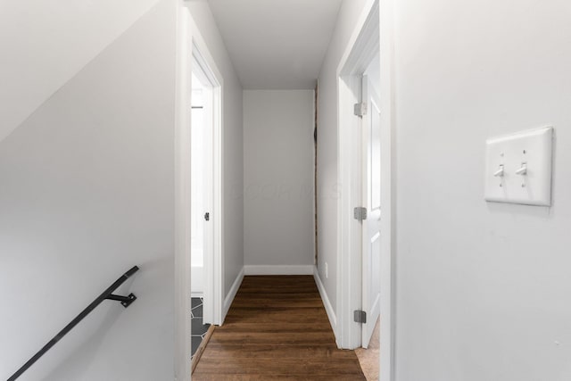 corridor featuring dark hardwood / wood-style flooring