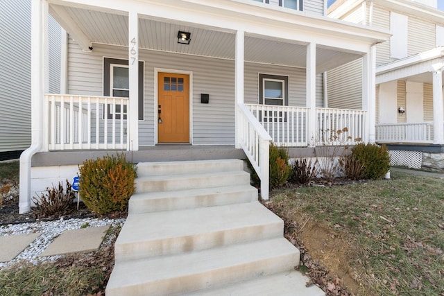 doorway to property featuring covered porch