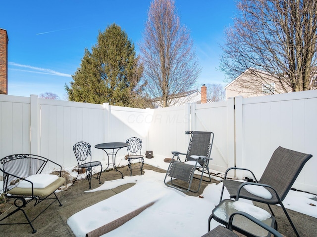 view of snow covered patio