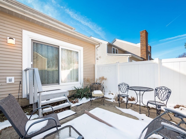 view of snow covered patio