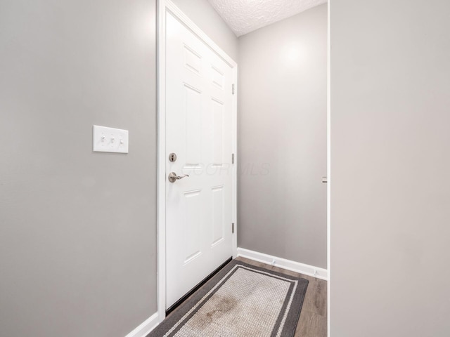 entryway featuring a textured ceiling