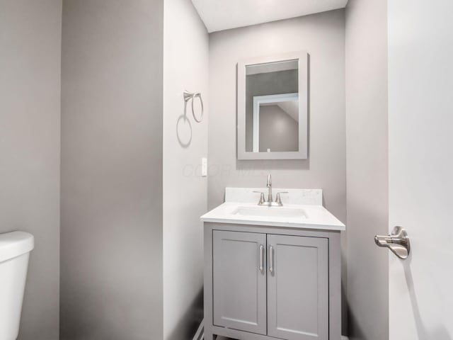 bathroom with vanity and toilet