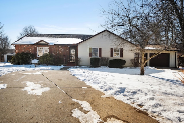 ranch-style house featuring a garage