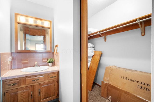 bathroom with vanity and backsplash