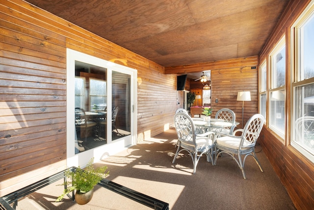 sunroom / solarium featuring wood ceiling