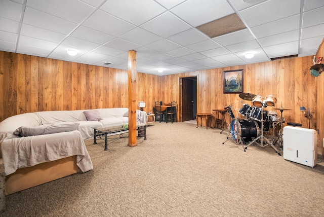 carpeted bedroom with a paneled ceiling