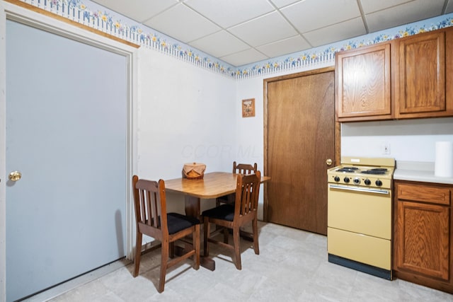 dining area with a paneled ceiling