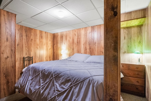 bedroom with wooden walls