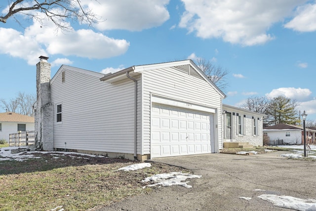 view of home's exterior with a garage