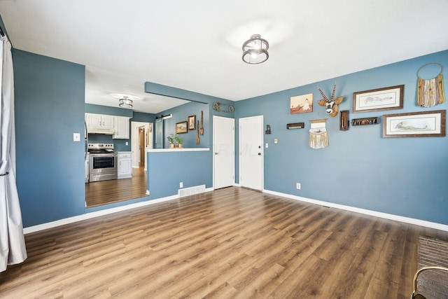 unfurnished living room featuring hardwood / wood-style floors