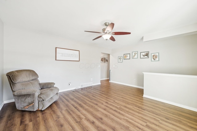 unfurnished room with hardwood / wood-style floors and ceiling fan