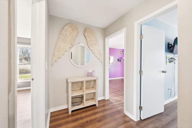 hall with dark hardwood / wood-style floors