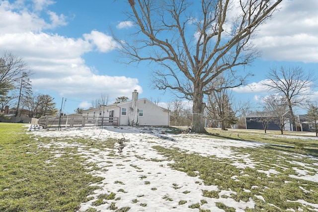 view of yard covered in snow