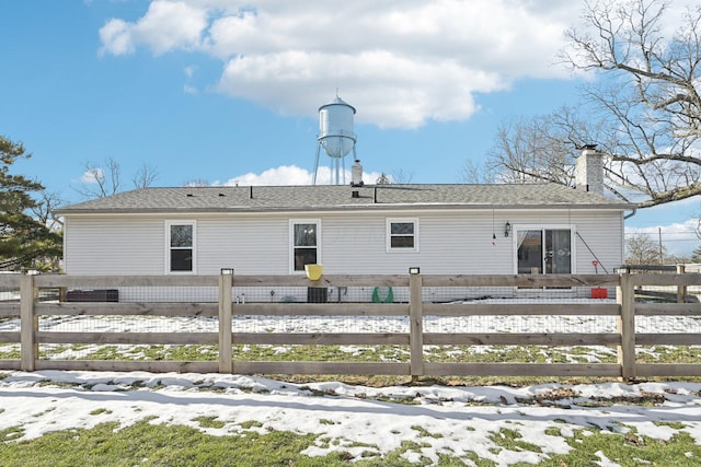 view of snow covered house