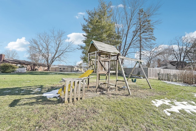 view of playground with a lawn