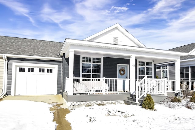 view of front facade featuring a garage and covered porch