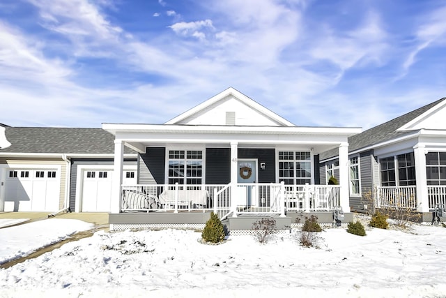 view of front facade featuring a garage and covered porch