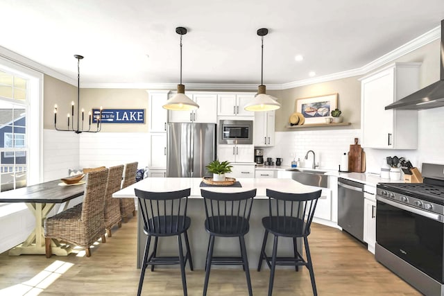 kitchen with breakfast area, stainless steel appliances, sink, and white cabinets