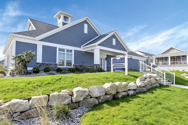 craftsman-style house with a front yard