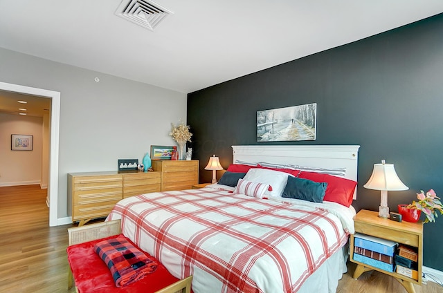 bedroom featuring hardwood / wood-style flooring