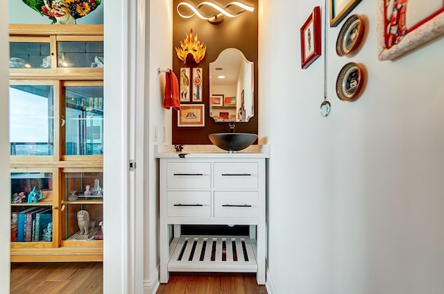 interior space featuring white cabinetry and wood-type flooring