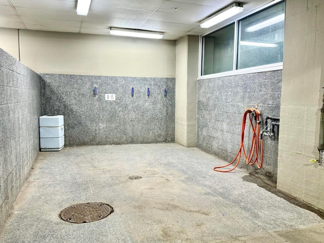 basement featuring a drop ceiling