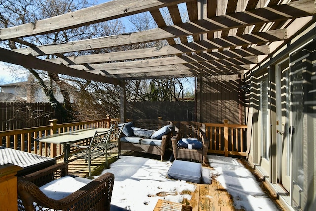 snow covered patio with an outdoor hangout area and a pergola