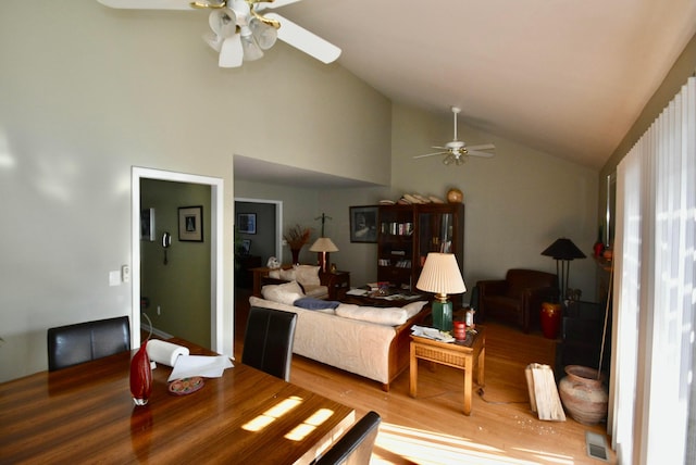 interior space featuring hardwood / wood-style flooring, lofted ceiling, and ceiling fan