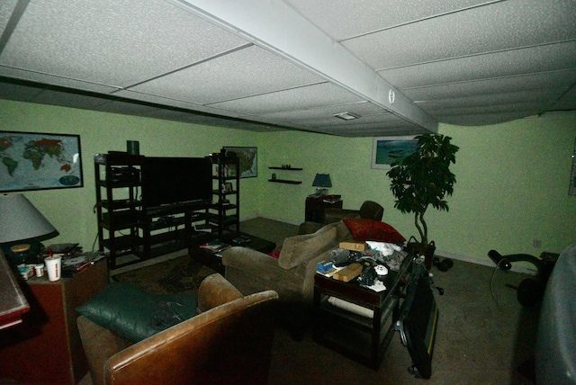 living room with a paneled ceiling