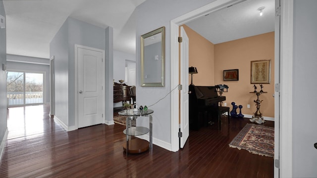 hallway with dark hardwood / wood-style floors