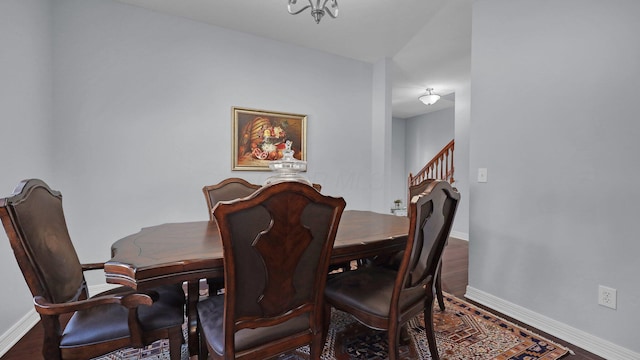 dining space with hardwood / wood-style floors