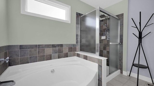 bathroom with tile patterned floors and separate shower and tub