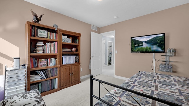 bedroom with light colored carpet