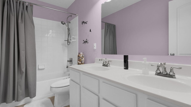 full bathroom with vanity, shower / bath combination with curtain, and toilet