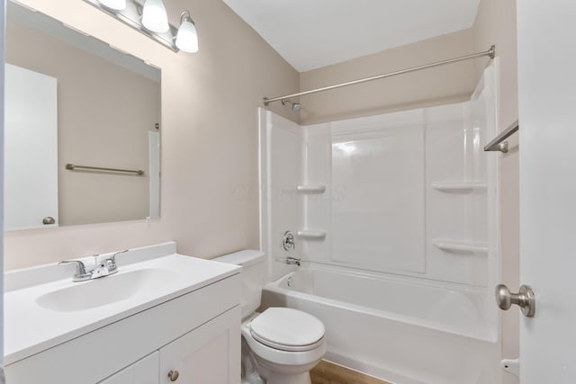 full bathroom featuring shower / bathtub combination, vanity, and toilet