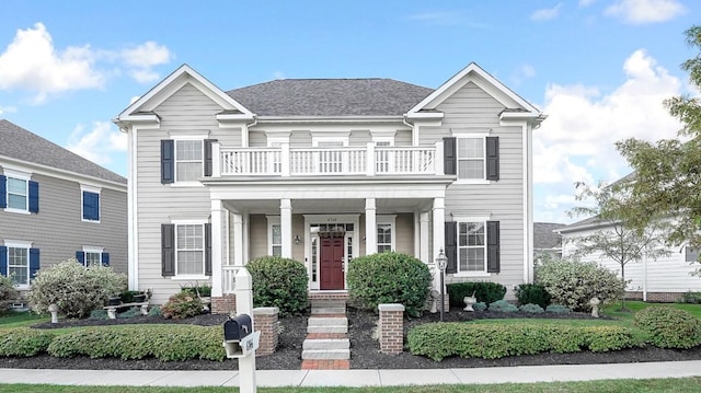 view of front of property with a balcony