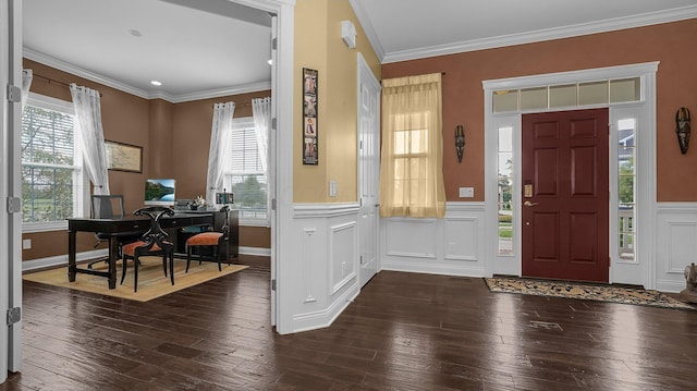 foyer entrance with dark wood-type flooring and ornamental molding