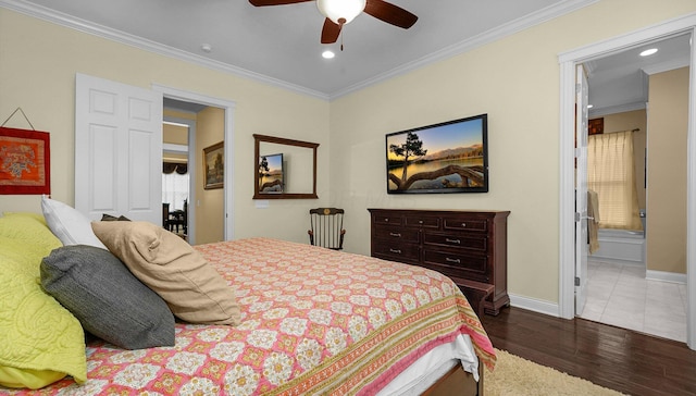 bedroom featuring crown molding, ensuite bathroom, ceiling fan, and dark hardwood / wood-style flooring