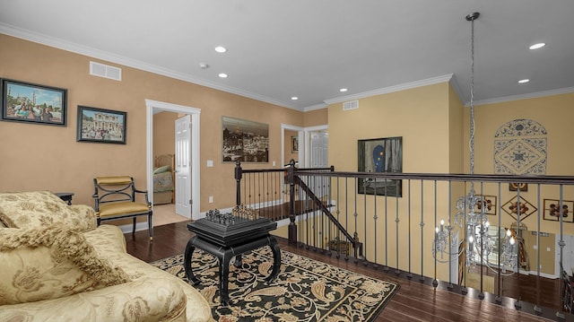 living room featuring hardwood / wood-style flooring and ornamental molding