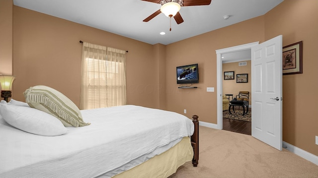 carpeted bedroom featuring ceiling fan