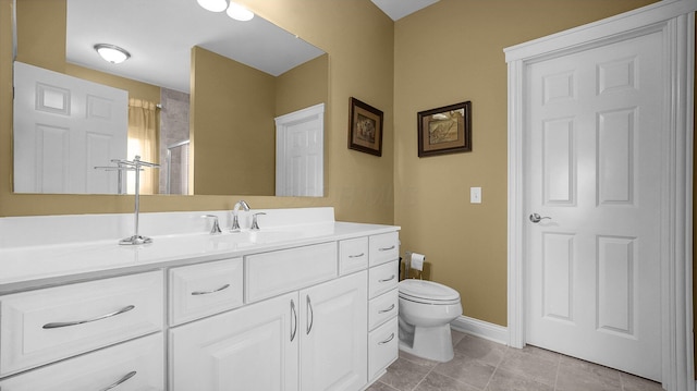 bathroom with vanity, walk in shower, tile patterned floors, and toilet