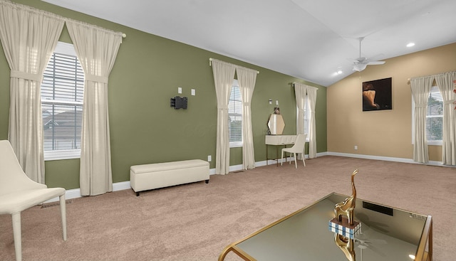 carpeted living room featuring lofted ceiling, a wealth of natural light, and ceiling fan