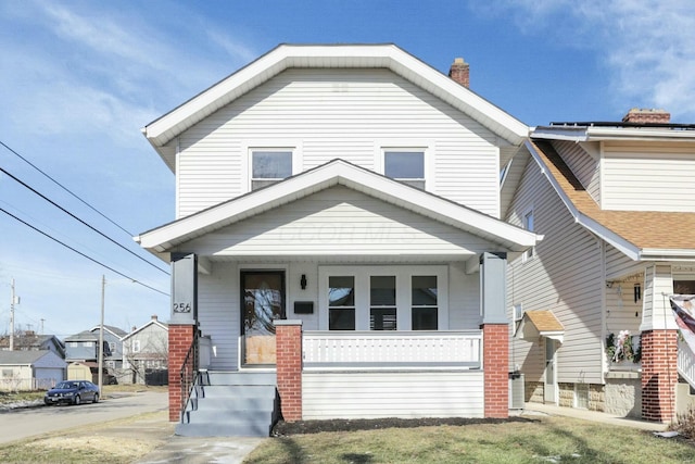 view of front facade with a porch and central air condition unit