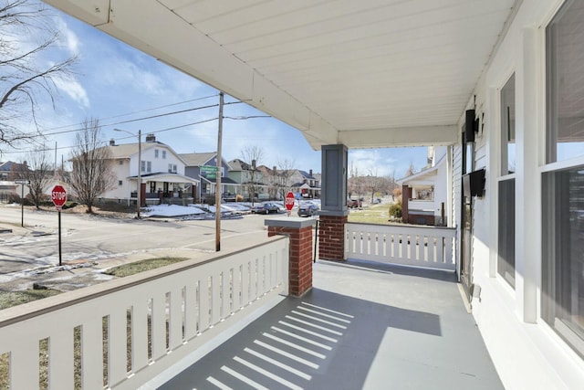 balcony featuring covered porch