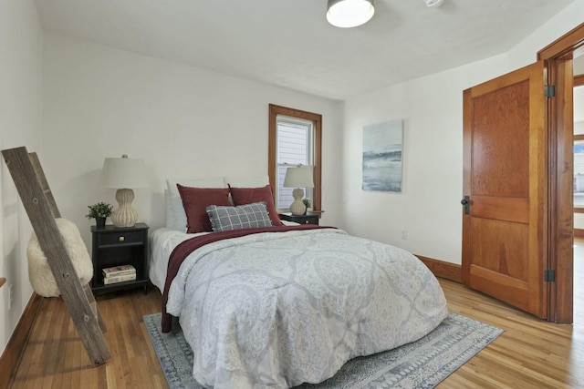 bedroom with hardwood / wood-style floors