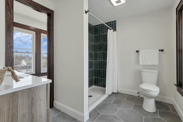 bathroom with walk in shower, tile patterned floors, and toilet