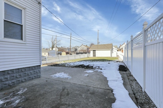 view of patio / terrace with an outbuilding