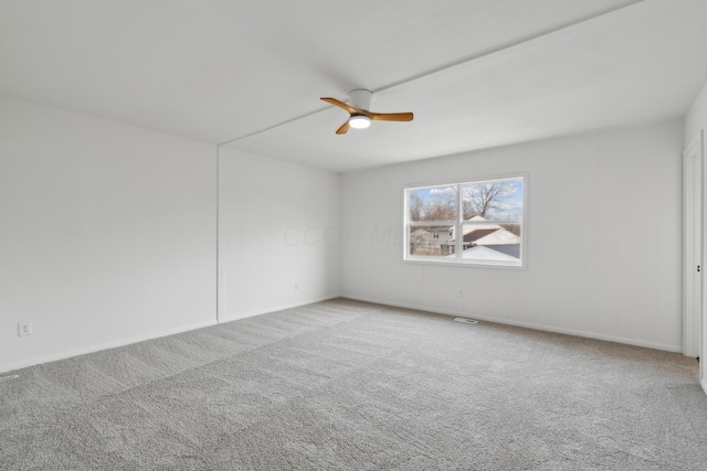 unfurnished room with carpet floors and ceiling fan