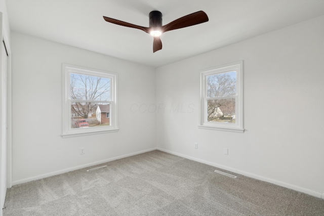 carpeted empty room with ceiling fan