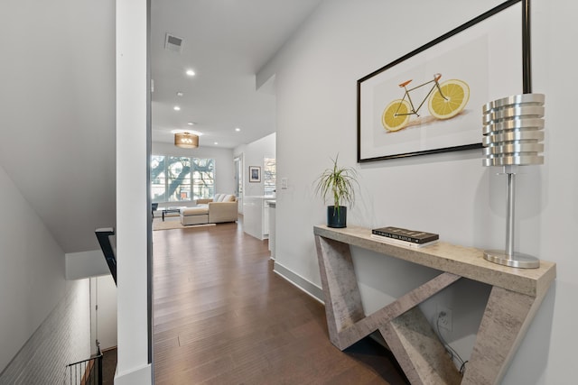 hallway with dark hardwood / wood-style floors